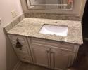 With the simple addition of this vintage-style cabinet paired with a granite counter, this bathroom is just stunning! 